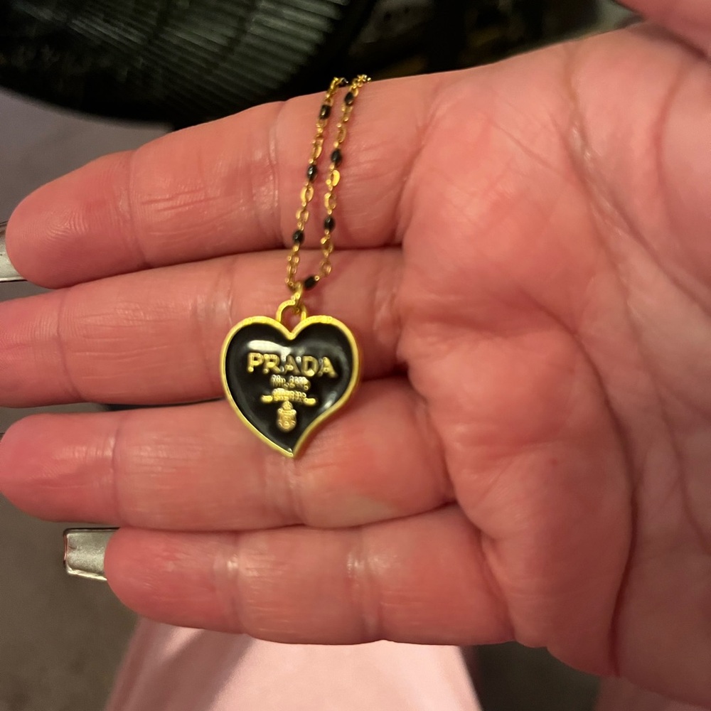 Prada Gold and Black Heart Necklace with Intricate Design